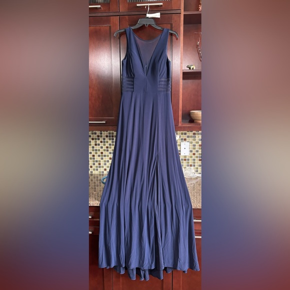 Navy blue fully lined ballgown with cutouts covered with navy, sheer mesh. - Picture 1 of 11